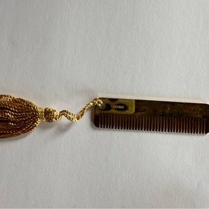 Two small gold combs with gold threaded tassel by Judith Leiber. Never used.